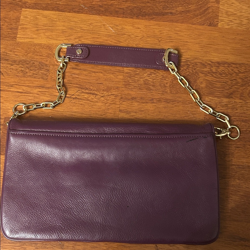 Tory Burch Plum/egg plant Leather Clutch with Gold Accents. - Picture 3 of 16